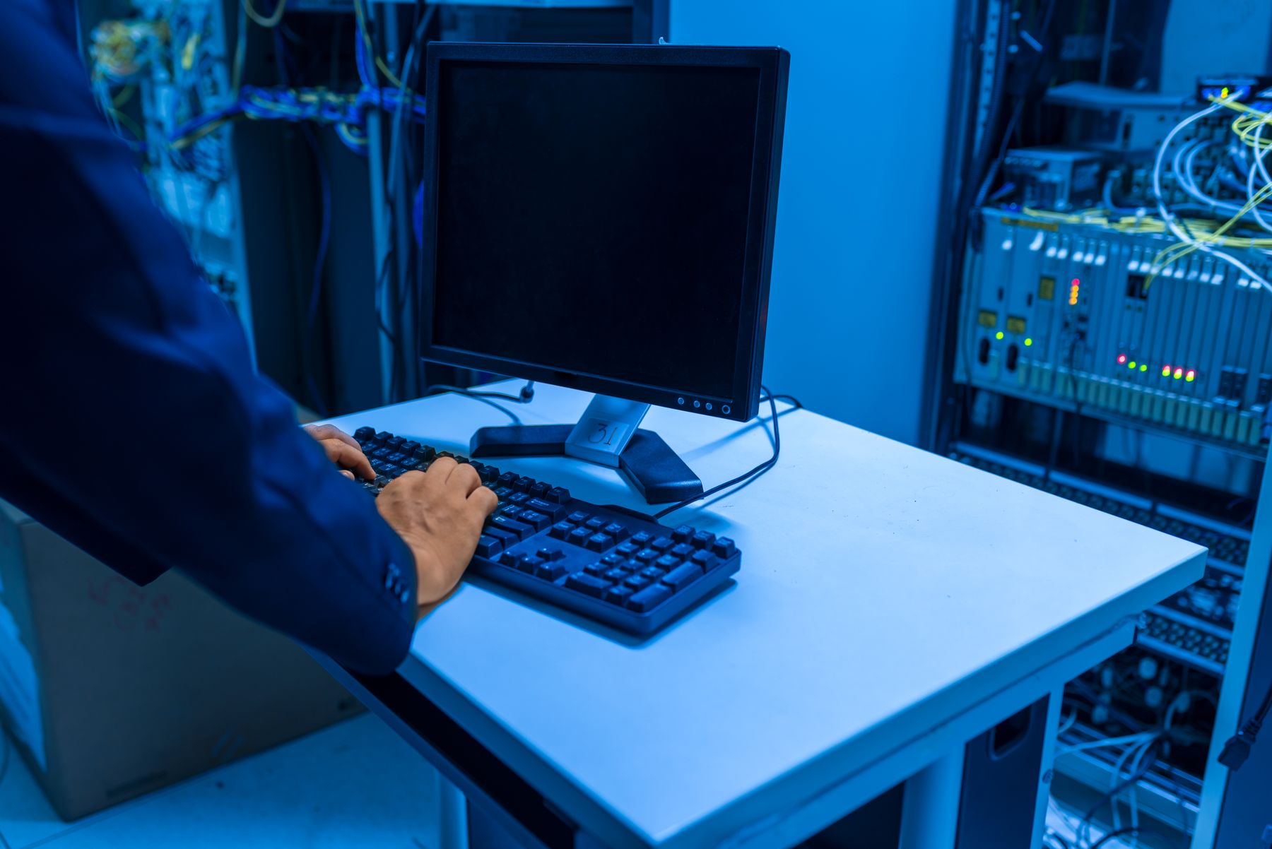 IT technician operating systems in a server room