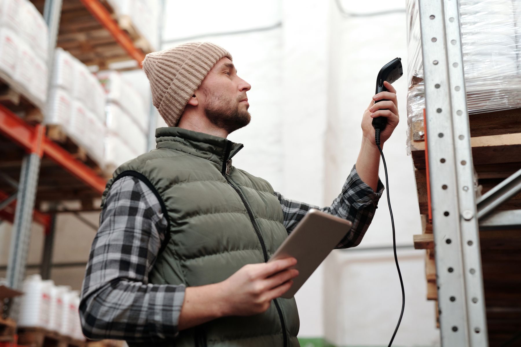 Warehouse operator scanning inventory with a handheld device